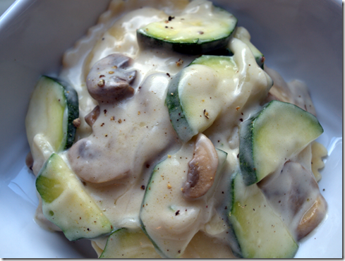 ravioli with cream sauce and veggies